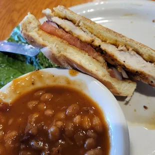 a plate of beans and a sandwich