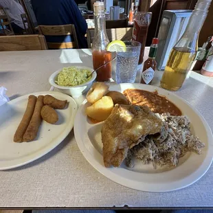 Combo platter chicken and que with Brunswick stew and slaw.