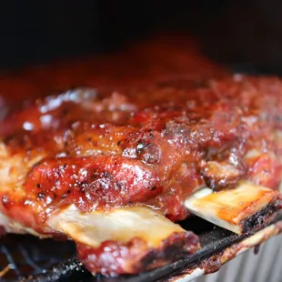 ribs cooking on a grill