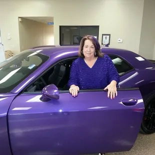 Nadine at the Front Desk dresses to match the Hellcat on the showroom floor.