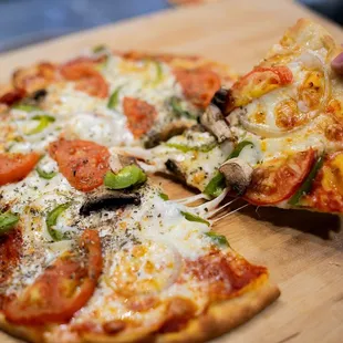 a slice of pizza on a cutting board