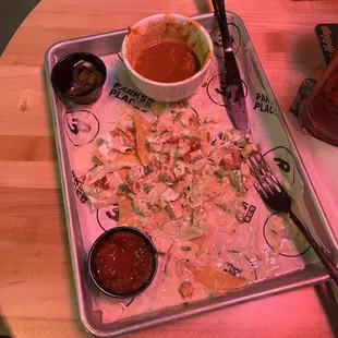 Just about finished chicken nachos with chili