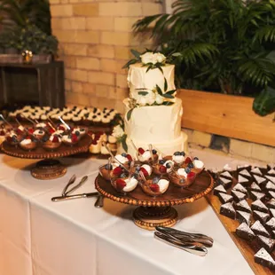 a table with a variety of desserts