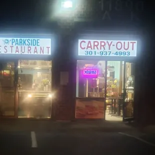 the front of a restaurant at night