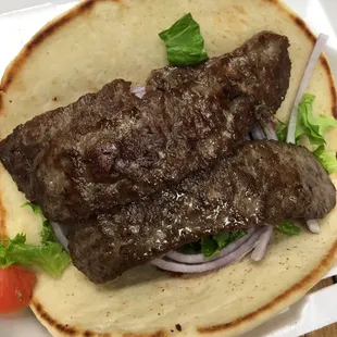 Gyro pita , lettuce tomatoes onion side of sauce