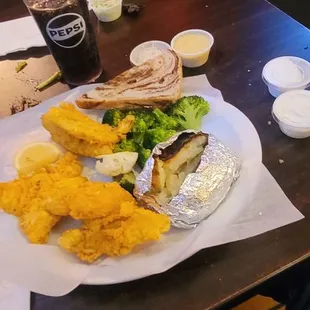 02/28/25 Friday night fish fry Wisconsin of course   Lake Perch dinner baked potato broccoli cauliflower straggler  rye bread