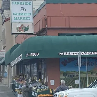 a truck parked in front of the store