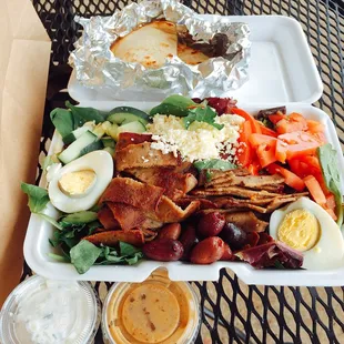 Greek salad w/ Gyro meat, tzatziki and balsamic vinaigrette on the side, warmed pita (kept warm for you in foil) - fresh and tasty.