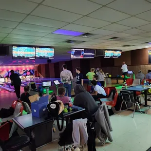 people playing a game of bowling