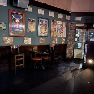 seating and posters on the wall