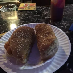 a sandwich on a paper plate