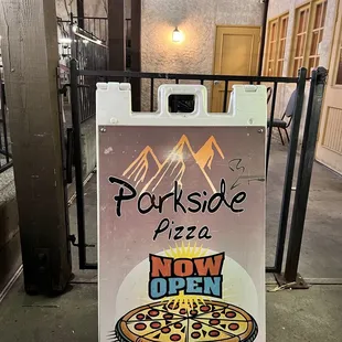 a sign for a new location