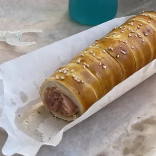 a hot dog wrapped in bread
