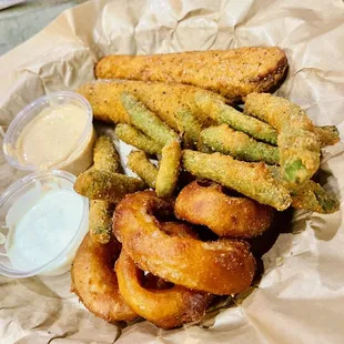 Appetizer trio with onion rings, fried green beans, and fried pickles. Served with ranch and cayenne ranch. Soooo good!!