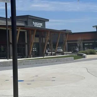 a parking lot with a parking meter in the foreground