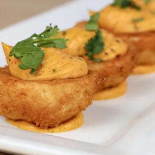 crab cakes on a white plate