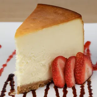 a piece of cheesecake with strawberries