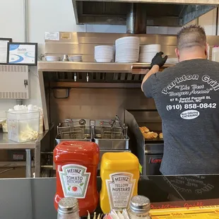 a man preparing food in the kitchen