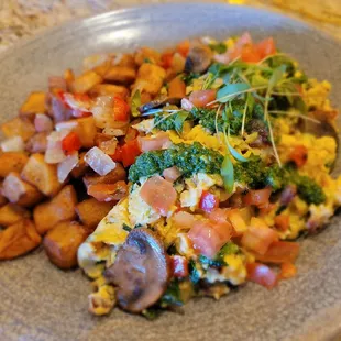 California Scramble
Three eggs, mushrooms, bacon, kale, tomato, Monterey Jack, arugula walnut pesto, cilantro, breakfast potatoes