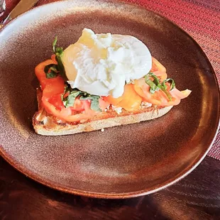 HEIRLOOM TOMATO TOAST:
Sourdough, Goat Cheese, Basil, Olive Oil, Poached Eggs