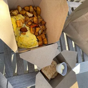 Omelet, potatoes, wheat toast.