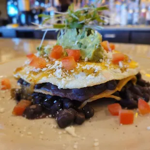 Huevos Rancheros
Corn tortillas, black beans, ranchero salsa, avocado puree, Cotija, tomato, micro cilantro