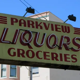 a sign for liquors grocerys