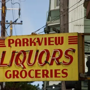 a sign for liquors and groceries