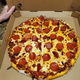 a pepperoni pizza in a box