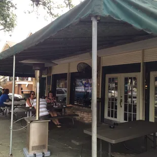 Outdoor patio for smoking, and avoiding the occasional summer deluge.