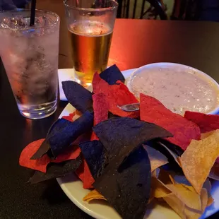 a plate of chips and a drink