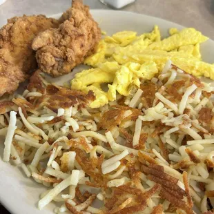 scrambled eggs. Scattered hash browns. Two tenders.