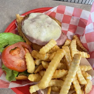 Chicken cordon blue with fries.