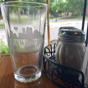 a glass of water and a salt shaker
