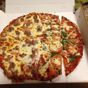 Half pepperoni + sausage, half tomato + spinach + garlic.