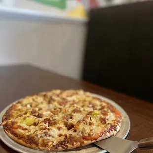BBQ chicken pizza with added banana peppers. Totally recommend