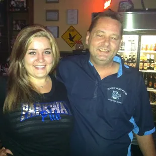 a man and a woman posing for a picture