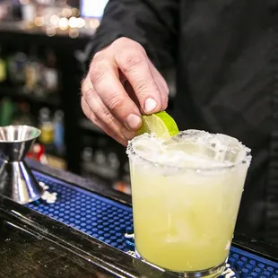 a bartender making a margarita