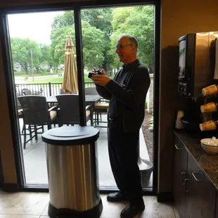 Outdoor seating area, orange/apple juice, and coffee machines