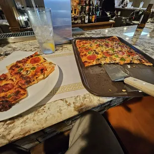 two pizzas on a table