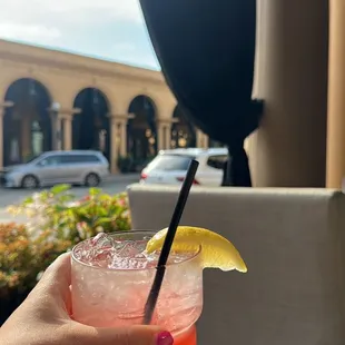 a person holding a drink