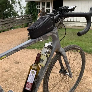 a bicycle with a bottle of wine