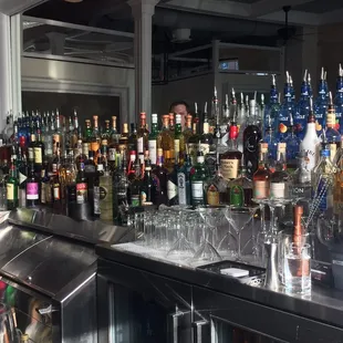 a bar filled with bottles of alcohol