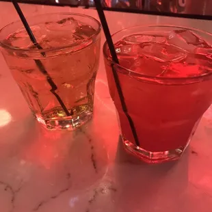 a close up of two glasses of drinks