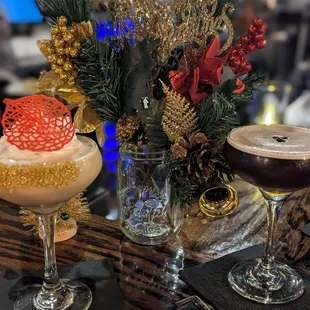 two cocktails on a bar