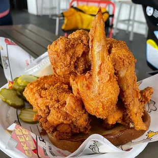 a plate of fried chicken and pickles