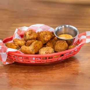 a basket of fried chicken nuggies