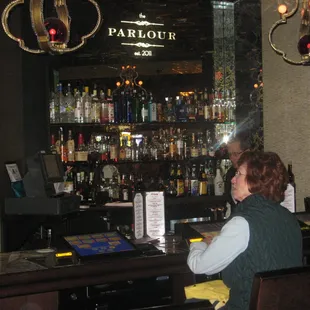 a woman sitting at the bar