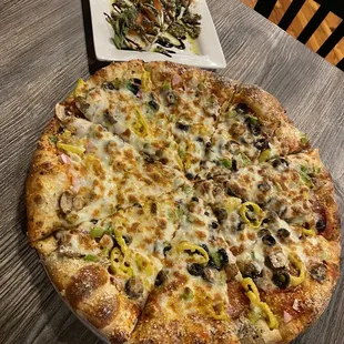 a pizza and a side dish