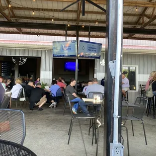 people sitting at tables in a restaurant